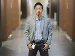 Journal de Montréal court reporter Michael Nguyen poses for a photograph at the Montreal Courthouse, Thursday, September 22, 2016.