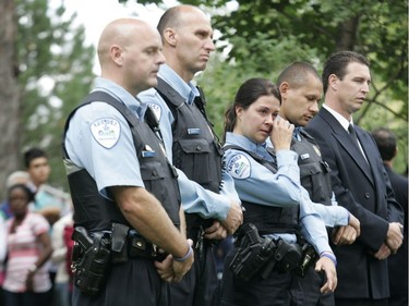 Montreal police (left to right) Denis Cote, Marco Barcarolo, Anne-Marie Dicaire, Alain Diallo, and Martin Dea at the one-year anniversary ceremony of the Dawson College shooting rampage, Sept. 13, 2007. Dicaire (seen wiping away tears) and Diallo were first on the scene.