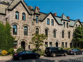 Built in 1889 by Lord Shaughnessy as one of a number of guest homes located across the street from his mansion, is currently up for sale in Montreal, on Wednesday, August 24, 2016 by owner Patricia Fraser for $996,000. The 3-storey apartment complete with a rooftop deck was at one time connected to the mansion (now the Canadian Centre for Architecture) via a tunnel. (Dave Sidaway / MONTREAL GAZETTE)