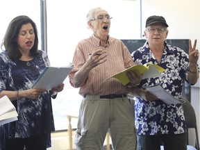 Roslyn Rabinovitch, Jerald Gould, centre, and Gerard Friedman rehearse a number at the Cummings Centre in August. The trio are members of the Glee Club, a choir made up of about a dozen people who have mental health issues.