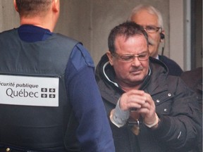 Raynald Desjardins, left, and Felice Racaniello exit the Joliette courthouse,  north of Montreal  on Wednesday December 21, 2011.