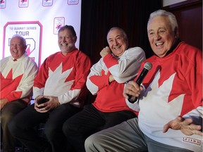 Phil Esposito (right) talks during news conference to promote the '72 Summit Series Tour along with former teammates (from the left) Yvan Cournoyer, Peter Mahovlich and Guy Lapointe on Feb. 9, 2016.