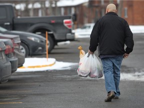 Shopper carry plastic grocery bags full of groceries at the Metro  in Notre-Dame-de-l'Île-Perrot, which supports ban all single-use plastic bags, like the ones used by groceries stores. (Marie-France Coallier / MONTREAL GAZETTE)