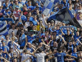 Montreal Impact fans cheer during the first half of the MLS soccer match between the Montreal Impact and the New York City FC at Saputo Stadium in Montreal on Sunday, July 17, 2016.
