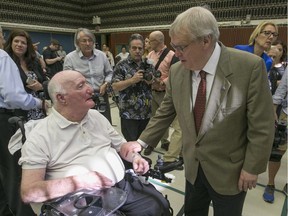 Quebec health minister Gaétan Barrette chats with Canadian armed forces veteran Stuart Vary at the Ste. Anne's Hospital. “We want to eliminate what isn’t working and multiply what does work — that’s the goal,” Barrette says of retirement homes.