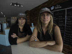 Carla Tabah, left, and Lynn Aziz, opened La Diperie, an ice cream parlour, in Dollard-des-Ormeaux on July 1. They have been battling the city ever since. (Peter McCabe / MONTREAL GAZETTE)