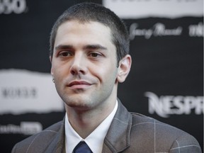 Film director Xavier Dolan poses for photos on the red carpet before the Montreal premiere of his film Juste la fin du monde (It's Only the End of the World) at the Théâtre Outremont in Montreal on Monday, September 12, 2016.