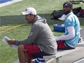 Montreal Alouettes starting quarterback Rakeem Cato, right, and offensive coordinator Anthony Calvillo sit away from rest of players during practice on Wednesday September 14, 2016. Cato was part of an argument the day before with Duron Carter and Kenny Stafford.