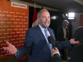 NDP leader Tom Mulcair talks to journalists in Montreal in September.