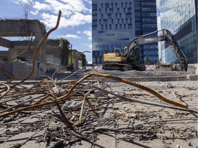 Twisted steel bars and and an abandoned tractor sit at Viger Square in Montreal, Thursday September 15, 2016. Construction to reconfigure the square is on hold because the City of Montreal hasn't received the go-ahead from Transport Quebec.