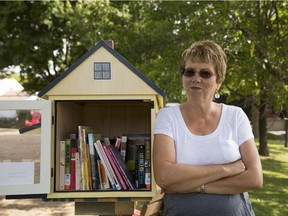 Carole Thériault  by the "book house" at Beacon Hill Park in Beaconsfield.  (Vincenzo D'Alto / Montreal Gazette)