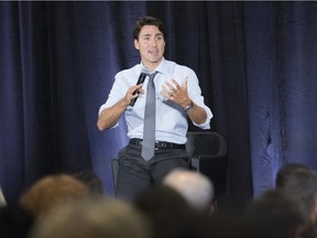 Prime Minister Justin Trudeau addresses an audience at a town hall meeting about how poverty is sexist toward girls and women, and how Canada can help stop it in Montreal, Saturday Sept. 17, 2016.