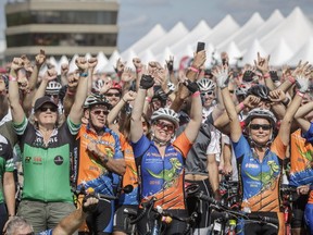 Cyclists cheer after finishing the 48-hour cycling ride to raise funds for the Make-A-Wish Quebec foundation at Jean-Drapeau Park in Montreal on Sunday, September 18, 2016. The 48-hour cycling event raised $1,906,000 for the Make-A-Wish Quebec foundation.
