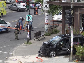 Police accident investigators at the corner of St-Viateur and St-Urbain Sts. following bank robbery and manhunt in Montreal on Friday, Sept. 2, 2016. Alain Ste-Marie and Geneviève Dallaire have both been convicted in the case.