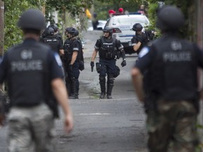 Police operation in laneway between Clark and and Saint-Urbain, following bank robbery and manhunt in the Mile End district on Friday.