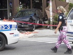 Police operation in Mile End following bank robbery and manhunt in Montreal on Friday, Sept. 2, 2016. The robbery getaway car was involved in an accident at the corner of St-Viateur and St-Urbain Sts.