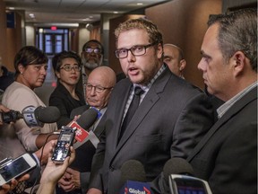 Marc-Antoine Cloutier, centre, a lawyer representing the Quebec taxi industry, is flanked by industry spokespersons Guy Chevrette, left, and Benoit Jugand following Tuesday's hearing.