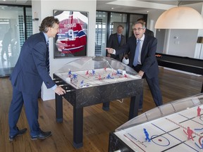 Brian Salpeter, left, with Daniel Peritz, right, and Guy Poulin at the Tour des Canadiens 1, where decorators stayed true to the hockey theme.