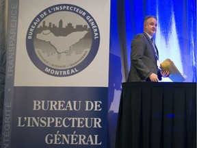 Montreal Inspector General Denis Gallant walks to a podium to address a conference with inspectors general from across North America, at the Palais des congrès in Montreal, Thursday, Sept. 22, 2016.