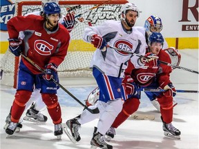 The Montreal Canadiens hit the practice ice for the first time this season at the Bell Sports Complexe in Brossard, on Friday, September 23, 2016. Newcomer Alexander Radulov, centre, is between Phillip Danault, left, and Paul Byron during a scrimmage as the Reds defeated the Whites 2-0.