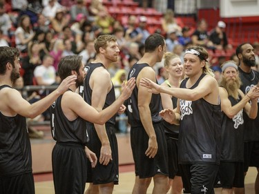 Win Butler of Arcade Fire greets his teammates before the start of the POP vs. Jock charity basketball game at the McGill University Sports Centre on Saturday, Sept. 24, 2016, held as part of POP Montreal.