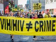 People walk along Ste-Catherine Street during the Farha Foundation's annual AIDS walk, in Montreal on Sunday, September 27, 2015.