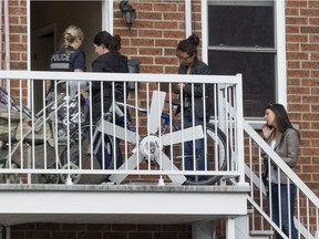 Police investigators enter a home where a young child nearly drowned in a bathtub on 3rd Avenue in Lachine on Sept. 28, 2016.