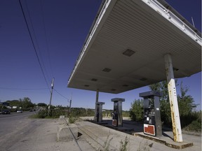 The abandoned gas station at 2146 Cité-des-Jeunes Blvd. in Vaudreuil-Dorion, Saturday, September 3, 2016. The city is appealing a court ruling hoping to have the pumps removed and the tanks, etc cleaned up. The surrounding site is the area selected for the new hospital. (Peter McCabe / MONTREAL GAZETTE)