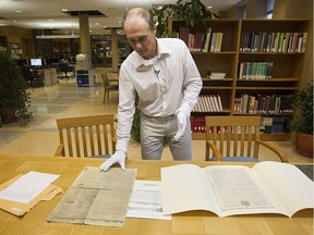 Daniel Chouinard, a specialist in historic newspapers at the Bibliothèque et archives nationales du Québec, examies the Dec. 30, 1799 edition of the Sussex Weekly Advertiser; or, Lewes Journal alongside the Montreal Gazette published on the same date.