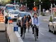 Cyclists navigate traffic as Sherbrooke Street West grinds to a halt during the evening rush hour in Montreal on Tuesday September 6, 2016.