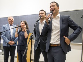 Parti Québécois leadership candidates Jean-François Lisée, Martine Ouellet, Paul St-Pierre Plamondon and Alexandre Cloutier talk over one another during debate at l'Université de Montréal in Montreal Tuesday September 6, 2016.