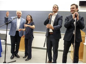 Parti Québécois leadership candidates Jean-François Lisée, Martine Ouellet, Alexandre Cloutier and Paul St-Pierre Plamondon compete for the floor during debate at Université de Montréal on Tuesday, Sept. 6, 2016.