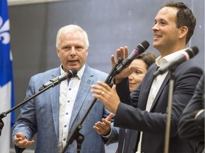 Parti Québécois leadership candidates Jean-Francois Lisée, left, interupts fellow candidate Alexandre Cloutier as Martine Ouellet gets caught in the middle during debate at Universite de Montreal in Montreal Tuesday September 6, 2016.