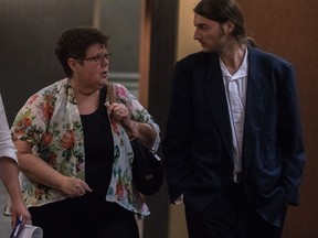 Diane Blanchette, sister of murder victim Denis Blanchette and Gael Ghiringhelli, a stage hand, leave the Bain trial courtroom at the Palais de Justice in Montreal, on Friday, September 9, 2016 during sentencing for Richard Henry Bain.