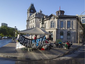 Striking Old Port workers camp out in front of the company's administration offices on de la Commune St. in Old Montreal, Sept. 9, 2016.