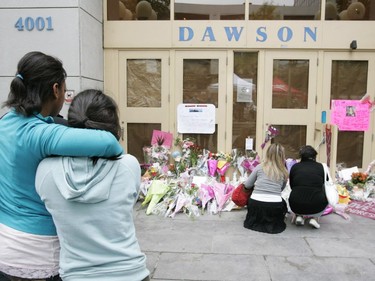 Students console each other and leave tributes outside Dawson College, Sept. 15, 2006, two days after the shooting rampage.