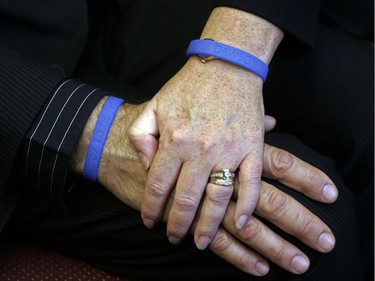 Nelson and Louise De Sousa wear blue rubber bracelets during media interviews at Dawson College,  Oct.17, 2006. The bracelets were being sold by Dawson students to raise money for the Anastasia De Sousa Memorial Award Fund set up to honour the student killed in the shooting spree a month earlier.