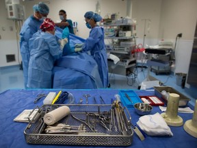 Sterile instruments are laid out as a male patient is prepped to have a cyst removed from his right knee at the Cambie Surgery Centre, in Vancouver on Wednesday, August 31, 2016. Dr. Brian Day, a self-styled champion of privatized health care, is bringing his fight to British Columbia Supreme Court on Tuesday for the start of a months-long trial he says is about patients' access to affordable treatment, while his opponents accuse him of trying to gut the core of Canada's medical system.