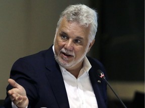 Philippe Couillard in August: The party's plans are focused on "health care, education and the economy," he said, as the Liberals met in Gatineau Wednesday.