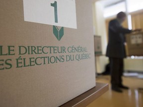 A man casts his ballot at an advance polling station in Montreal in 2014.