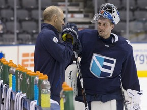 Team Europe head coach Ralph Krueger, left, talks to goaltender Jaroslav Halak during a practice session at the World Cup of Hockey in Toronto on Friday, Sept. 23, 2016.