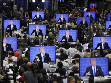 Republican presidential candidate Donald Trump is seen on screens in the media center during the presidential debate between Trump and Democratic presidential candidate Hillary Clinton at Hofstra University, Monday, Sept. 26, 2016, in Hempstead, N.Y.