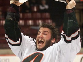 Quebec Trois-Rivieres Patriotes' Roberto "Bob" Bissonnette lifts the University Cup as he celebrates their 3-0 victory over St. Francis Xavier in the men's university hockey championship in Fredericton in a March 23, 2003, file photo. The Quebec Capitales baseball team released a statement confirming Bissonnette's death in a New Brunswick helicopter crash Sunday evening. The statement also mentions that team president Michel Laplante was also on board and survived, describing his injuries as non-life threatening.