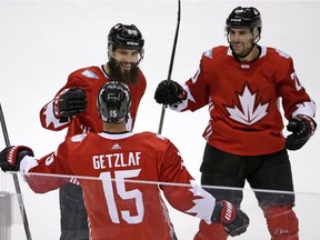 Team Canada's Ryan Getzlaf (15) celebrates his overtime goal against Russia with Brent Burns (88) and John Tavares (20) in a World Cup of Hockey exhibition game in Pittsburgh on Wednesday, Sept. 14, 2016. Canada won 3-2.