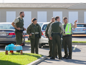 Sûreté du Québec officers in Saint-Hyacinthe are on the scene after two people were found badly injured in a home. The woman later died, Sept. 13, 2016.