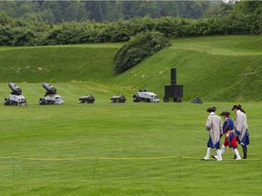 Costumed actors walk through the grounds of the Fort Lennox National Historic Site in Saint-Paul-de-l'Ile-aux-Noix, south of south of Saint-Jean-sur-Richelieu: In spring 1777, British General John Burgoyne gathered an army near Île-aux-Noix. He would press south from Canada down the Hudson River valley toward Albany, seeking to drive a wedge between New England and the supposedly less revolutionary colonies to the south.