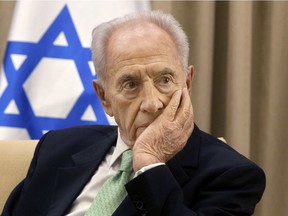 In this Oct. 28, 2013, file photo, Israel's President Shimon Peres, listens during a meeting at the president's residence in Jerusalem. Peres died at age 93, the Israeli news website YNet reported early Wednesday.