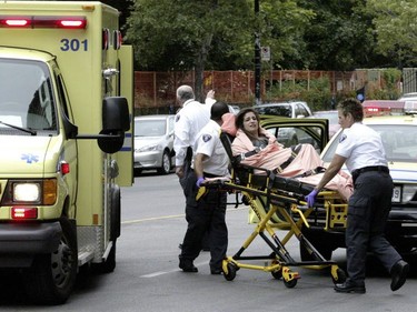 An injured student is helped by ambulance technicians following the Dawson College rampage, Sept. 13, 2006.