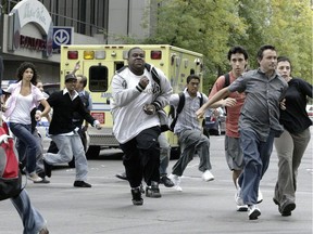 Students flee Dawson College on Sept. 13, 2006 after a shooting at the downtown CEGEP.