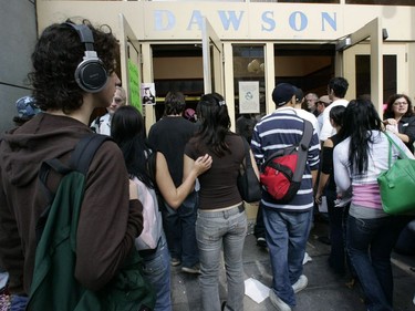 Students return to remove a wall of flowers and re-enter Dawson College, Sept. 18, 2006. It was the first time students entered the building since the shooting rampage five days earlier.